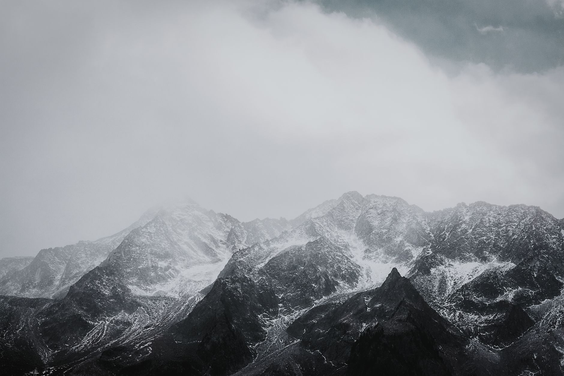 Alpine mountains under misty sky